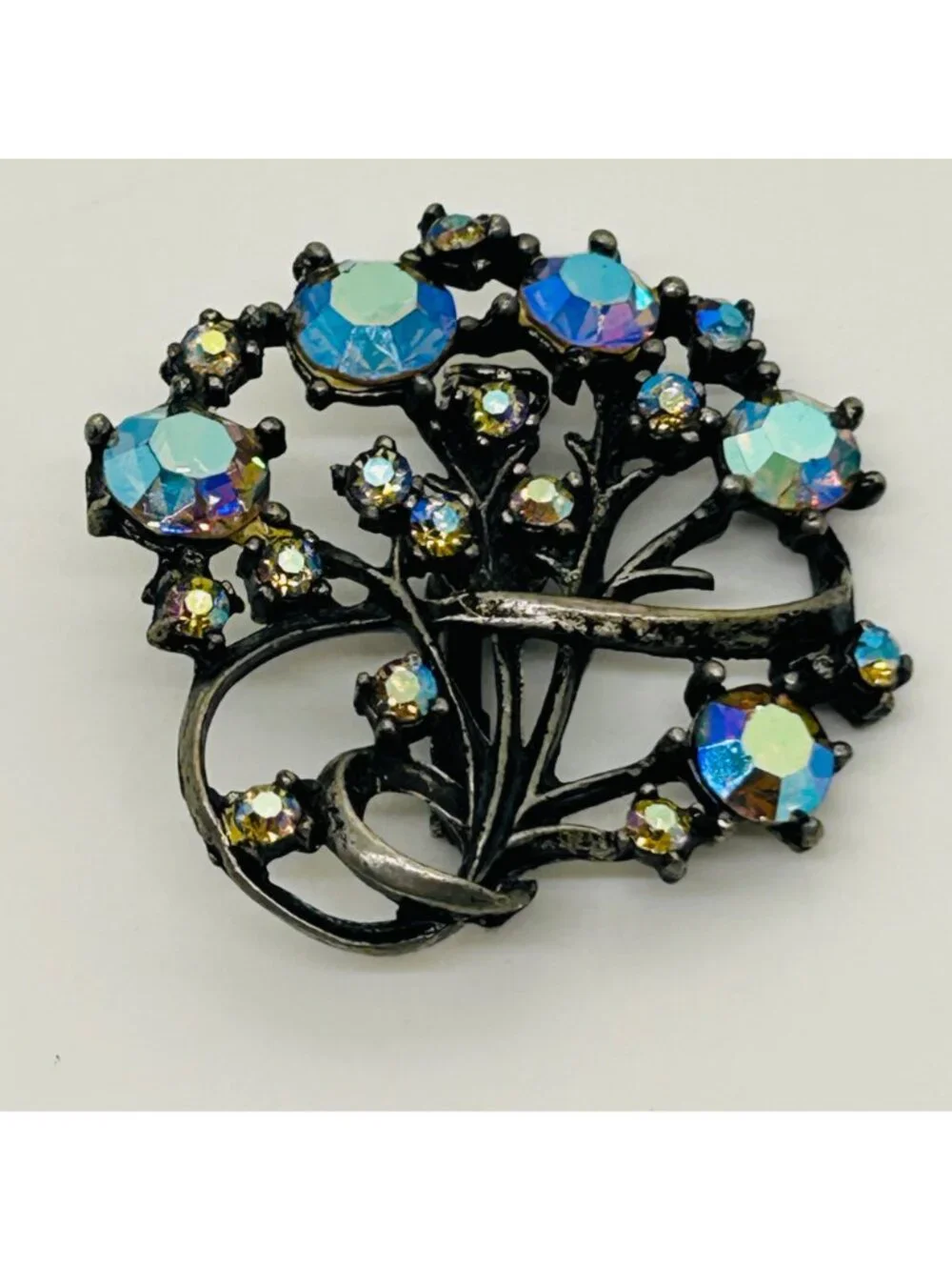 Vintage Aurora Borealis Rhinestone Brooch Peacock Colored Pin Gunmetal